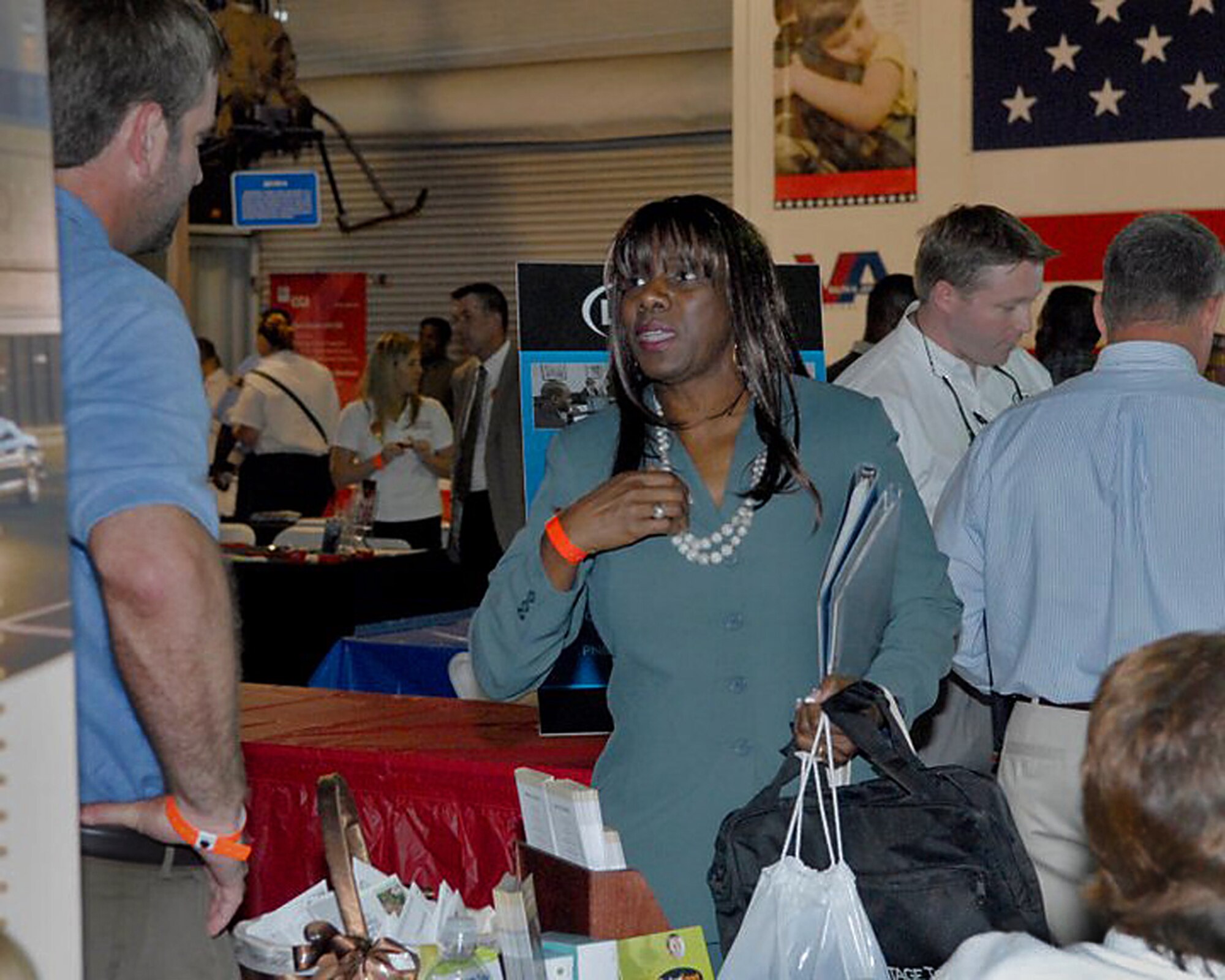 Retired Senior Master Sgt. Alma Lowery, formerly of the 38th Aerial Port Squadron at Joint Base Charleston, browses for job at the Charleston VA Welcome Home event aboard the USS Yorktown May 5, 2011. (Photo courtesy of the Charleston VA)