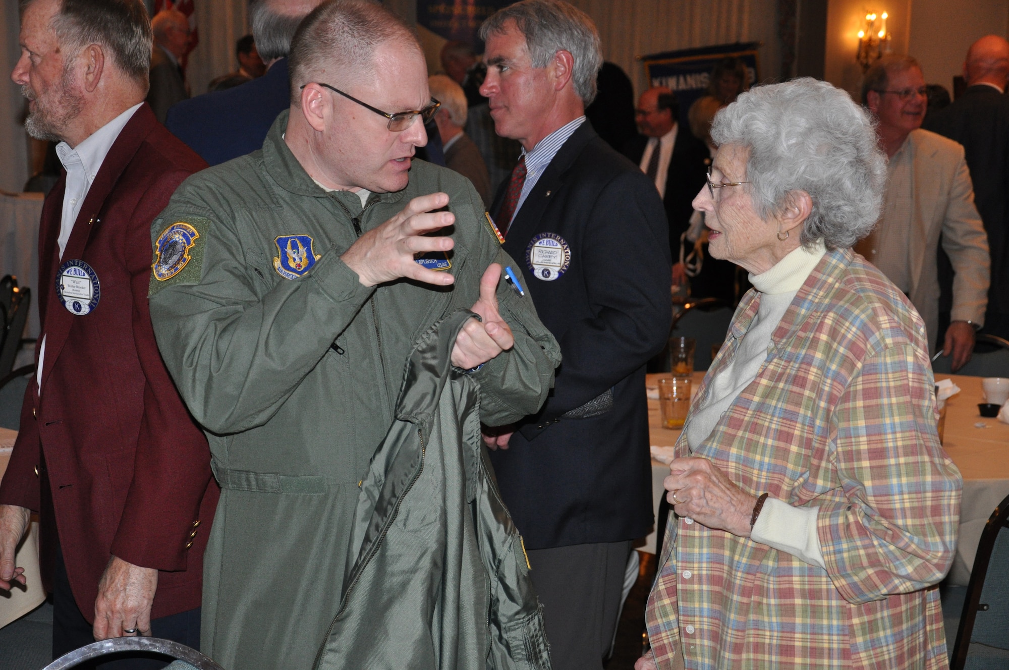 WRIGHT-PATTERSON AIR FORCE BASE, Ohio – Senior Master Sgt. Michael Kalbfleisch, 89th Airlift Squadron shares his experiences as a flight engineer with Springfield Kiwanis Club member Ms. Ruth Folz during the 30th Annual Armed Forces Day luncheon May 3. More than 235 people attended the luncheon sponsored by the Springfield Rotary Club, Springfield Kiwanis Club, Springfield Exchange Club and the Miami Valley Military Affairs Association, is held annually to recognize and honor area military units, installations and assigned personnel who serve the Springfield-Clark County community, the State of Ohio and the United States. (U.S. Air Force photo/Lt. Col. Cynthia Harris)