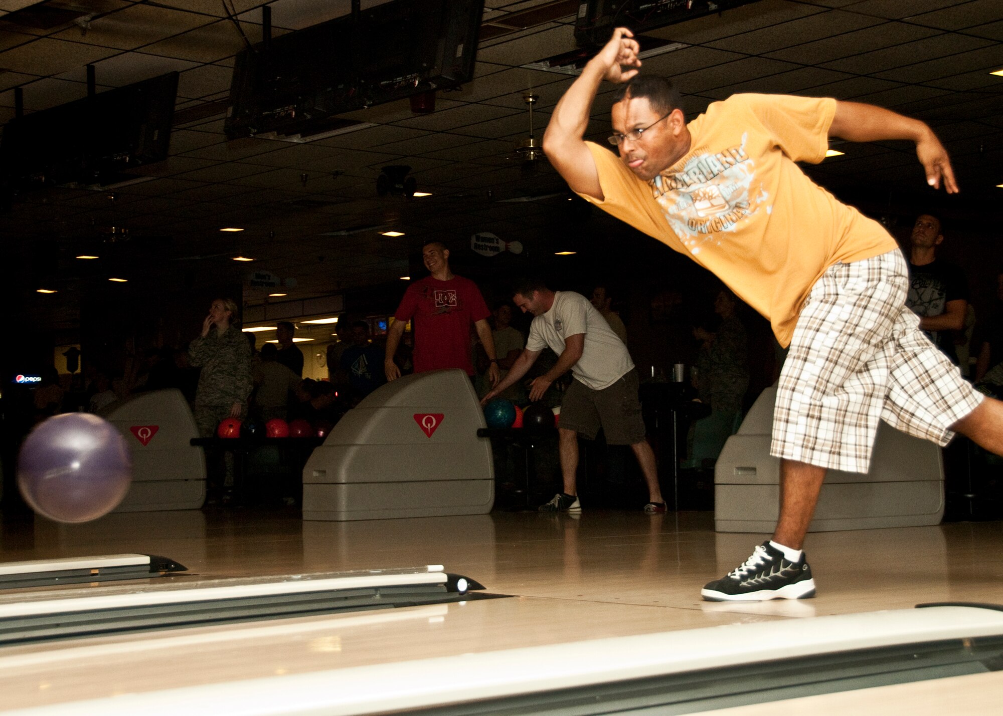 Staff Sgt. Noah Moore, 46th Air Maintenance Squadron, bowls a strike at the Air Force Assistance Fund Bowling Rally fundraiser held May 6 at the Eglin Bowling Alley.  More than 100 bowlers came out and helped the 46th AMXS raise over $500. All money raised will benefit the 2011 AFAF. (U.S. Air Force Photo/Sachel Seabrook)                     