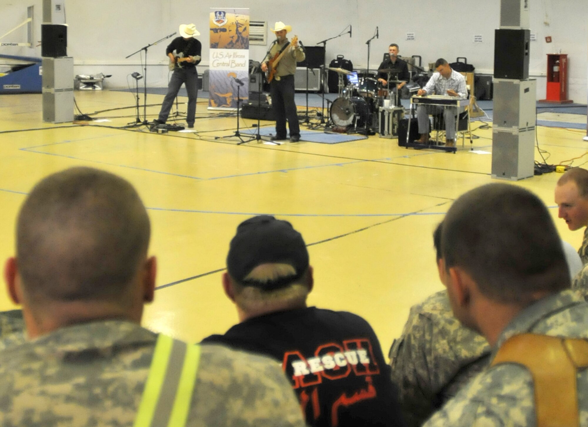CONTINGENCY OPERATING SITE MAREZ, Iraq – Soldiers assigned to 4th Advise and Assist Brigade, 1st Cavalry Division, and civilian contractors watch the Air Forces Central band, "Wild Blue Country" perform at the Contingency Operating Site Marez main gym, April 29, 2011. The Air Force band thanked the deployed troops and contractors for their service and sacrifice by performing mainstream country songs during a two-hour concert. After the show, the band signed autographed CDs and took pictures with the deployed Fort Hood troopers and civilians. 
(U.S. Army photo by Spc. Terence Ewings, 4th AAB PAO, 1st Cav. Div., USD-N)
