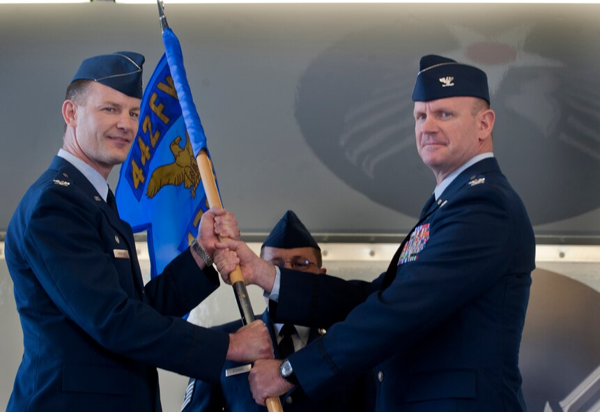 MOODY AIR FORCE BASE, Ga. -- Col. Eric Overturf, 442nd Fighter Wing commander, hands the guidon to the new 476th Fighter Group commander, Col. Christian Funk, during a change of command ceremony May. 7. Colonel Funk was previously the Aviation Tactics Evaluation Group deputy commander and director of staff at Fort Bragg, N.C.  (U.S. Air Force photo/Airman 1st Class Douglas Ellis)(RELEASED)
