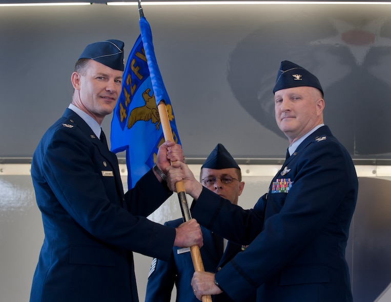 MOODY AIR FORCE BASE, Ga. -- Col. Eric Overturf, 442nd Fighter Wing commander, receives the guidon from the outgoing 476th Fighter Group commander, Col. Gregory Eckfeld, during a change of command ceremony May. 7.  Colonel Eckfeld was the commander of the 476th FG from May 2008 to May 2011. (U.S. Air Force photo/Airman 1st Class Douglas Ellis)(RELEASED)
