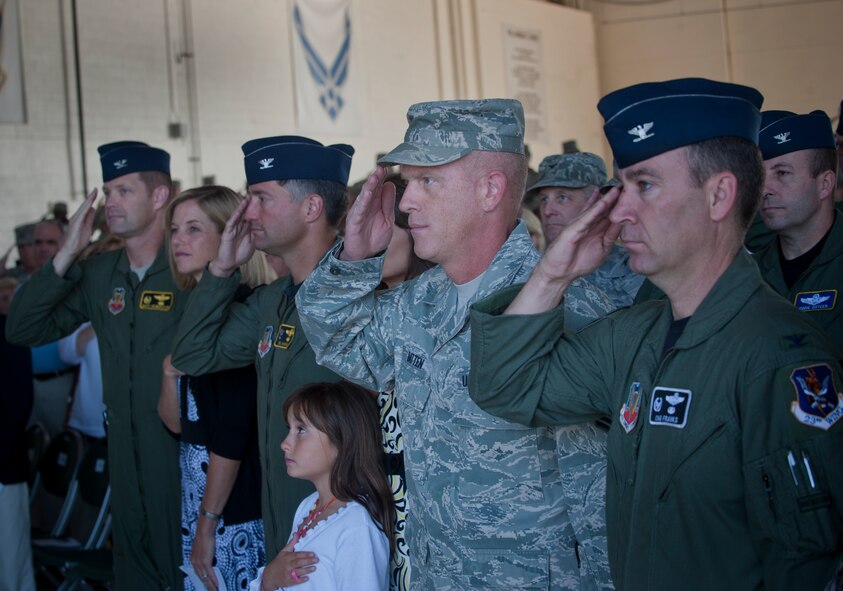 MOODY AIR FORCE BASE, Ga. -- Moody members salute the colors while the national anthem is played during a change of command ceremony May 7. The 476th Fighter Group and the 23rd Wing share facilities and equipment in what is known as total force integration. (U.S. Air Force photo/Airman 1st Class Douglas Ellis)(RELEASED)
