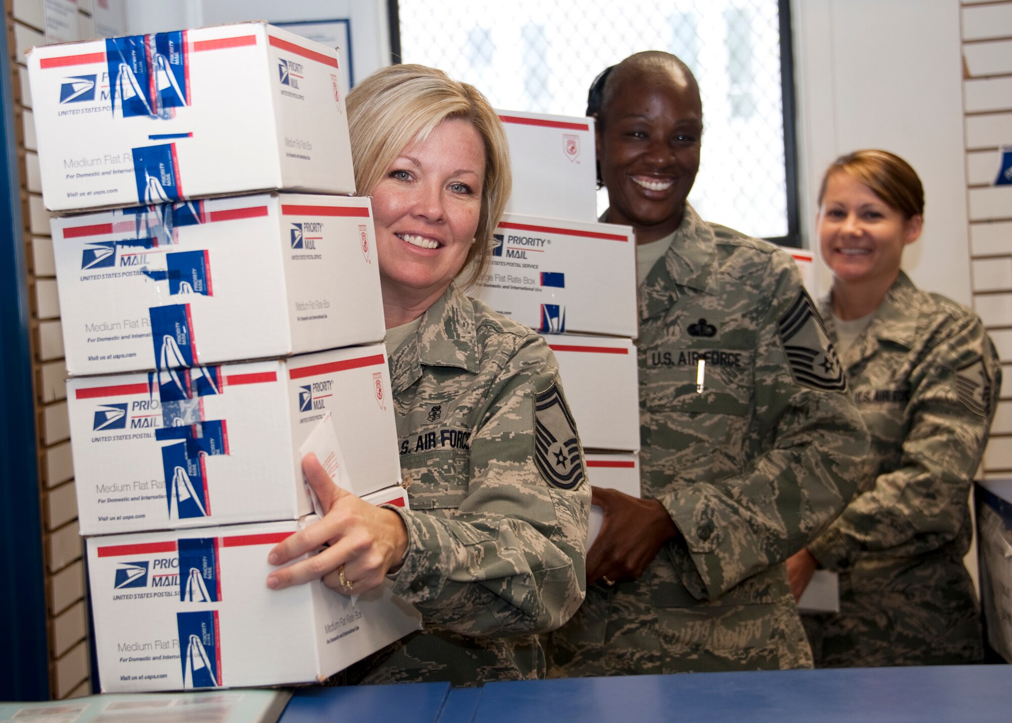 Senior Master Sgt. Lisa Buckman, 96th Force Support Squadron, Chief Master Sgt. Vatema Ivy, 96th FSS, and Master Sgt. Carrie Procita, 33rd Maintenance Operations Squadron, deliver care packages to Team Eglin members deployed overseas May 6.  A "team effort" from Team Eglin made it possible to "send some love" with help from 96th FSS, Eglin Top 3, Company Grade Officers Council, the Chiefs Group and the Hard Rock Café in Destin.  (U.S. Air Force photo/Samuel King Jr.)