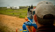 Chief Master Sgt. (ret.) William Walter lines up a shot with his mounted Rocket Propelled Grenade launcher April 26, 2011 at a range on Eglin Air Force Base, Florida.  Mr. Walter, Air Force Special Operations Command A5 strike requirements office, helps conduct a demonstration of what damage an RPG can do to a helicopter annually.  The helicopter is an UH1 Huey.(U.S. Air Force photo by Senior Airman David Salanitri/Released)