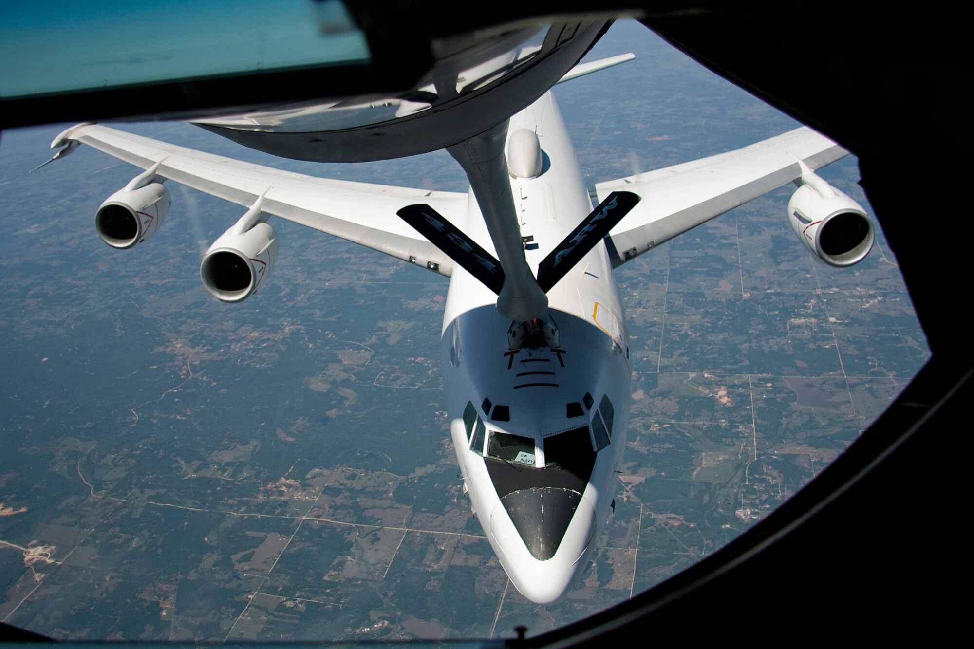 GRISSOM AIR RESERVE BASE, Ind. -- A U.S. Navy E-6B Mercury refuels from a 434th Air Refueling Wing KC-135R Stratotanker during a refueling mission May 5. The E-6, which used the call sign Shadow 20, is a ccommunications relay and strategic airborne command post aircraft. Two squadrons, the "Ironmen" of VQ-3 and the "Shadows" of VQ-4 deploy more than 20 aircrews from Tinker Air Force Base, Okla. Onboard the KC-135 were Indiana media representatives who got a firsthand look at the aerial refueling mission of the 434th ARW. (U.S. Air Force photo/Tech. Sgt. Mark R. W. Orders-Woempner)
