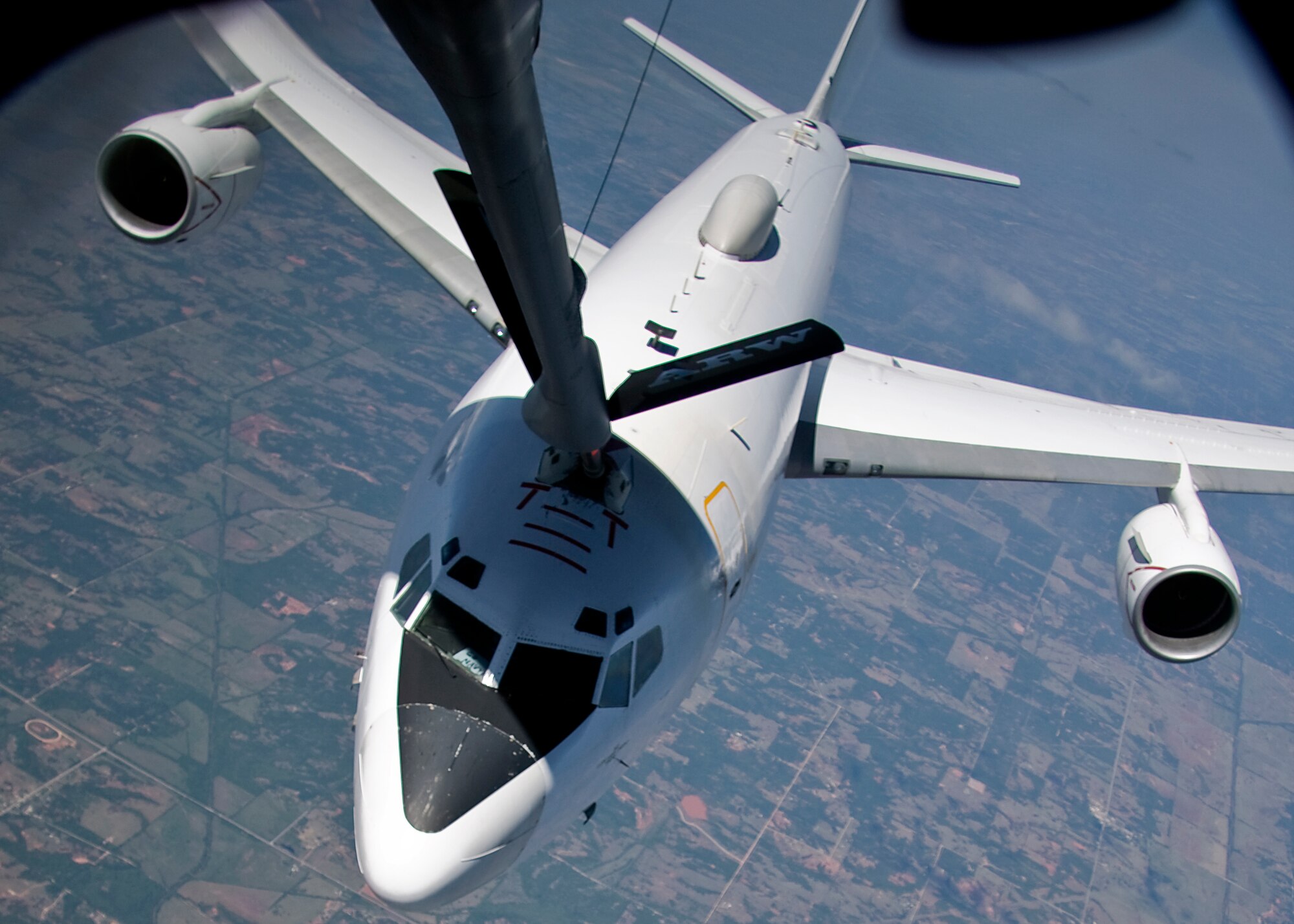 GRISSOM AIR RESERVE BASE, Ind. -- A U.S. Navy E-6B Mercury refuels from a 434th Air Refueling Wing KC-135R Stratotanker during a refueling mission May 5. The E-6, which used the call sign Shadow 20, is a ccommunications relay and strategic airborne command post aircraft. Two squadrons, the "Ironmen" of VQ-3 and the "Shadows" of VQ-4 deploy more than 20 aircrews from Tinker Air Force Base, Okla. Onboard the KC-135 were Indiana media representatives who got a firsthand look at the aerial refueling mission of the 434th ARW. (U.S. Air Force photo/Tech. Sgt. Mark R. W. Orders-Woempner)
