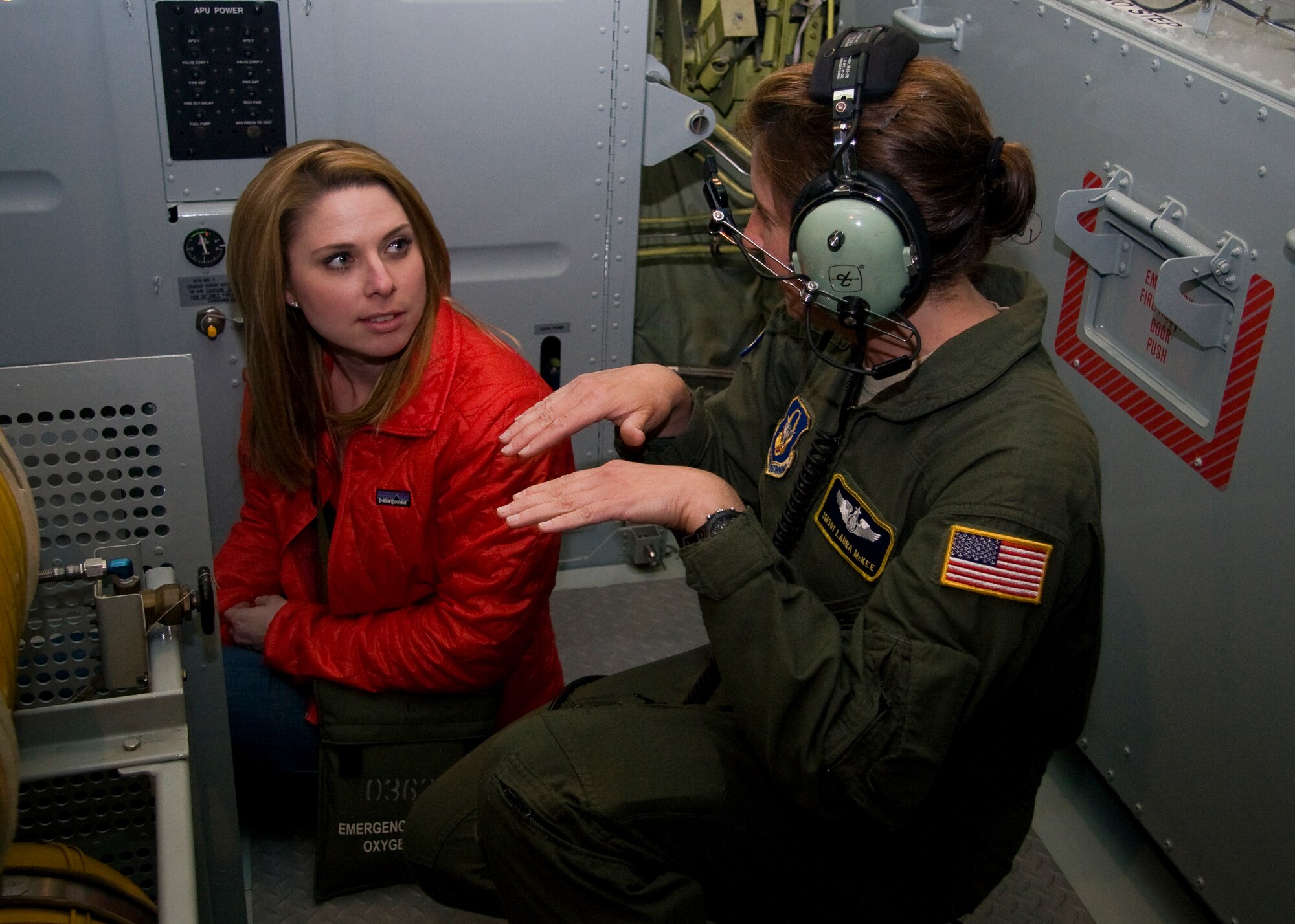 GRISSOM AIR RESERVE BASE, Ind. -- Senior Master Sgt. Laura McKee, 72nd Air Refueling Squadron in-flight refueling instructor, explains the process of aerial refueling to Nicole Misencik in the back of a KC-135R Stratotanker near the boom pod during a media orientation flight May 5. During the flight 13 new and traditional media representatives were able to witness firsthand the mission of the 434th Air Refueling Wing as the 72nd ARS crew refueled a U.S. Navy E-6 from Tinker Air Force Base, Okla. Mrs. Misencik is a meteorologist and reporter with WTHR in Indianapolis and was also named the 2010 Social Media Dame at the Indiana Social Media Summit. (U.S. Air Force photo/Tech. Sgt. Mark R. W. Orders-Woempner)

