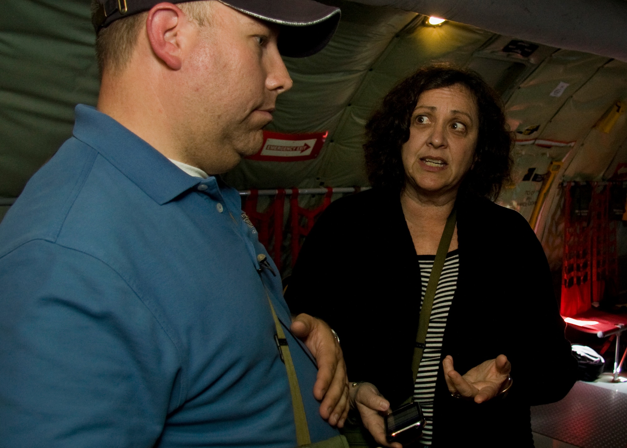 GRISSOM AIR RESERVE BASE, Ind. -- Lorraine Ball and Scott Allen have a discussion onboard one of Grissom's KC-135R Stratotankers during a media orientation flight May 5. During the flight 13 new and traditional media representatives were able to witness firsthand the mission of the 434th Air Refueling Wing as the Grissom crew refueled a U.S. Navy E-6 from Tinker Air Force Base, Okla.  Ms. Ball is the owner of a small business marketing company and social media blogger. Mr. Allen is a photojournalist with WTHR in Indianapolis. (U.S. Air Force photo/Tech. Sgt. Mark R. W. Orders-Woempner)
