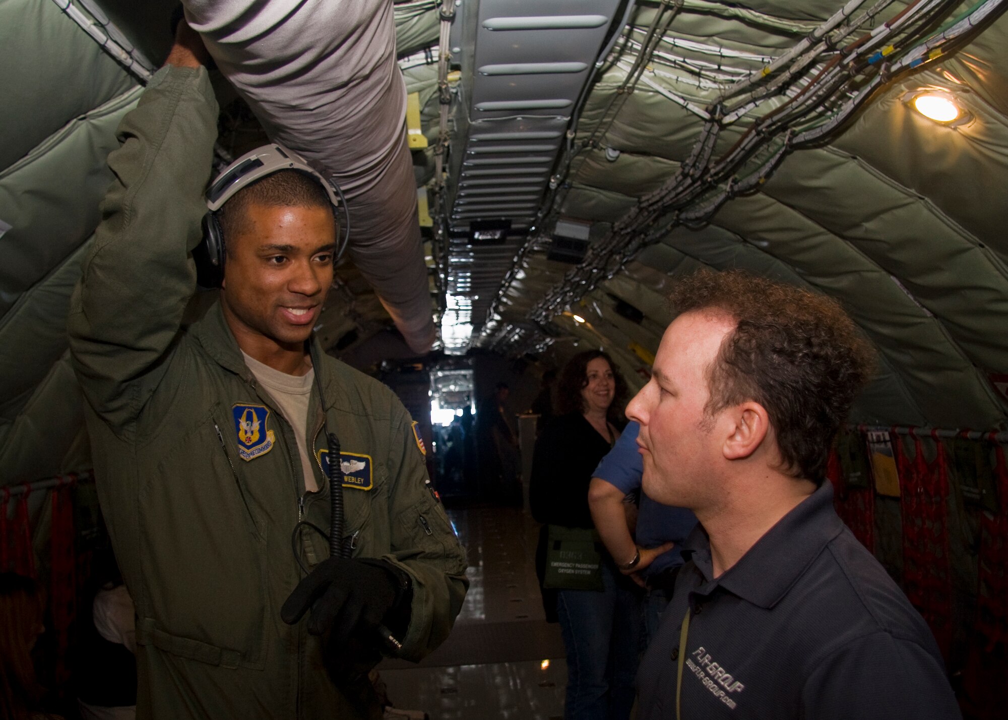 GRISSOM AIR RESERVE BASE, Ind. -- Capt. Joel Webley, 72nd Air Refeuling Squadron aircraft commander, talks with Don Costanza about what it?s like to be a pilot in the Air Force Reserve during a recent media orientation flight May 5. Mr. Costanza, a news director for Flight Line Radio, along with 12 other new and traditional media representatives took part in the special flight to witness firsthand the aerial refueling mission of the 434th Air Refueling Wing. (U.S. Air Force photo/Tech. Sgt. Mark R. W. Orders-Woempner)
