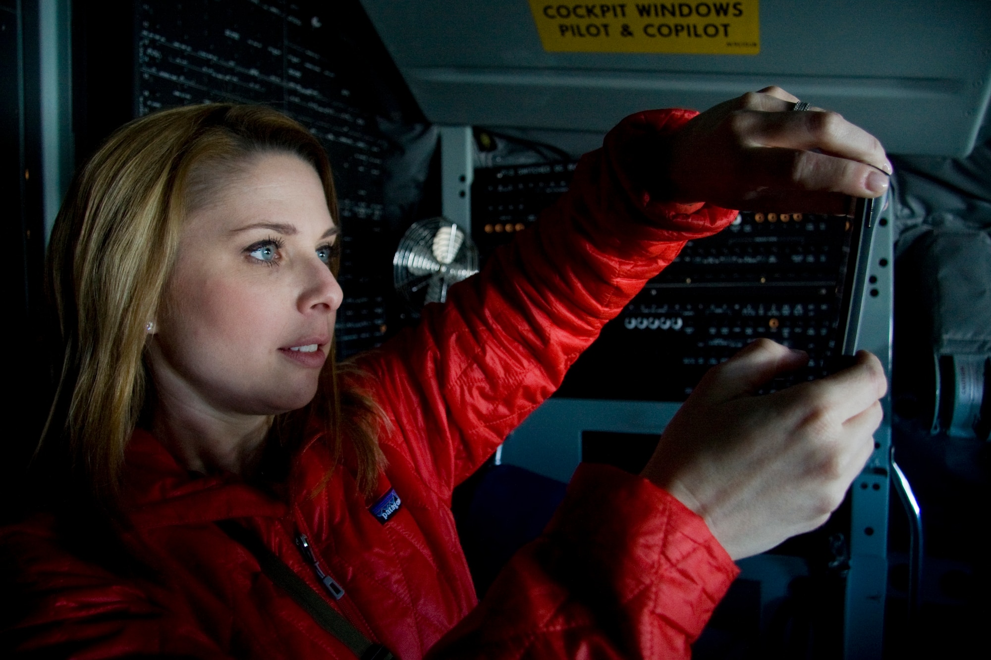 GRISSOM AIR RESERVE BASE, Ind. -- Nicole Misencik uses here smart phone to take a photo of a KC-135R Stratotanker cockpit during a media orientation flight held May 5. During the flight 13 new and traditional media representatives were able to witness firsthand the mission of the 434th Air Refueling Wing as the crew refueled a U.S. Navy E-6 from Tinker Air Force Base, Okla. Mrs. Misencik is a meteorologist and reporter with WTHR in Indianapolis and was also named the 2010 Social Media Dame at the Indiana Social Media Summit. (U.S. Air Force photo/Tech. Sgt. Mark R. W. Orders-Woempner)
