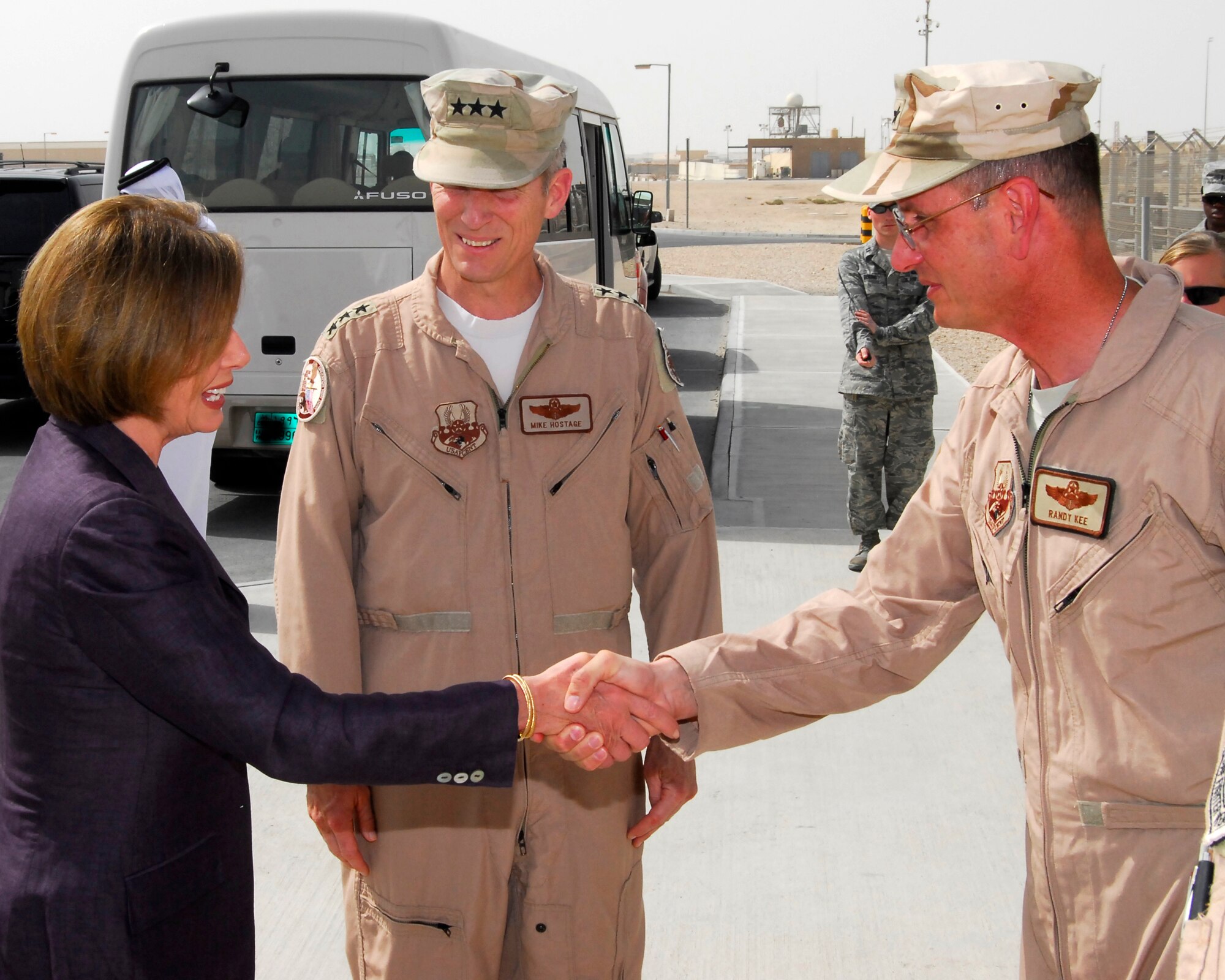 U.S. Congresswoman Nancy Pelosi of California's 8th District greets Lt. Gen. Mike Hostage, U.S. Air Forces Central commander, and Brig. Gen. Randy Kee, 379th Air Expeditionary Wing commander, during a visit by a bi-partisan Congressional delegation to this undisclosed location in Southwest Asia, May 8, 2011. (U.S. Air Force photo/Senior Master Sgt. Kevin Tucker)