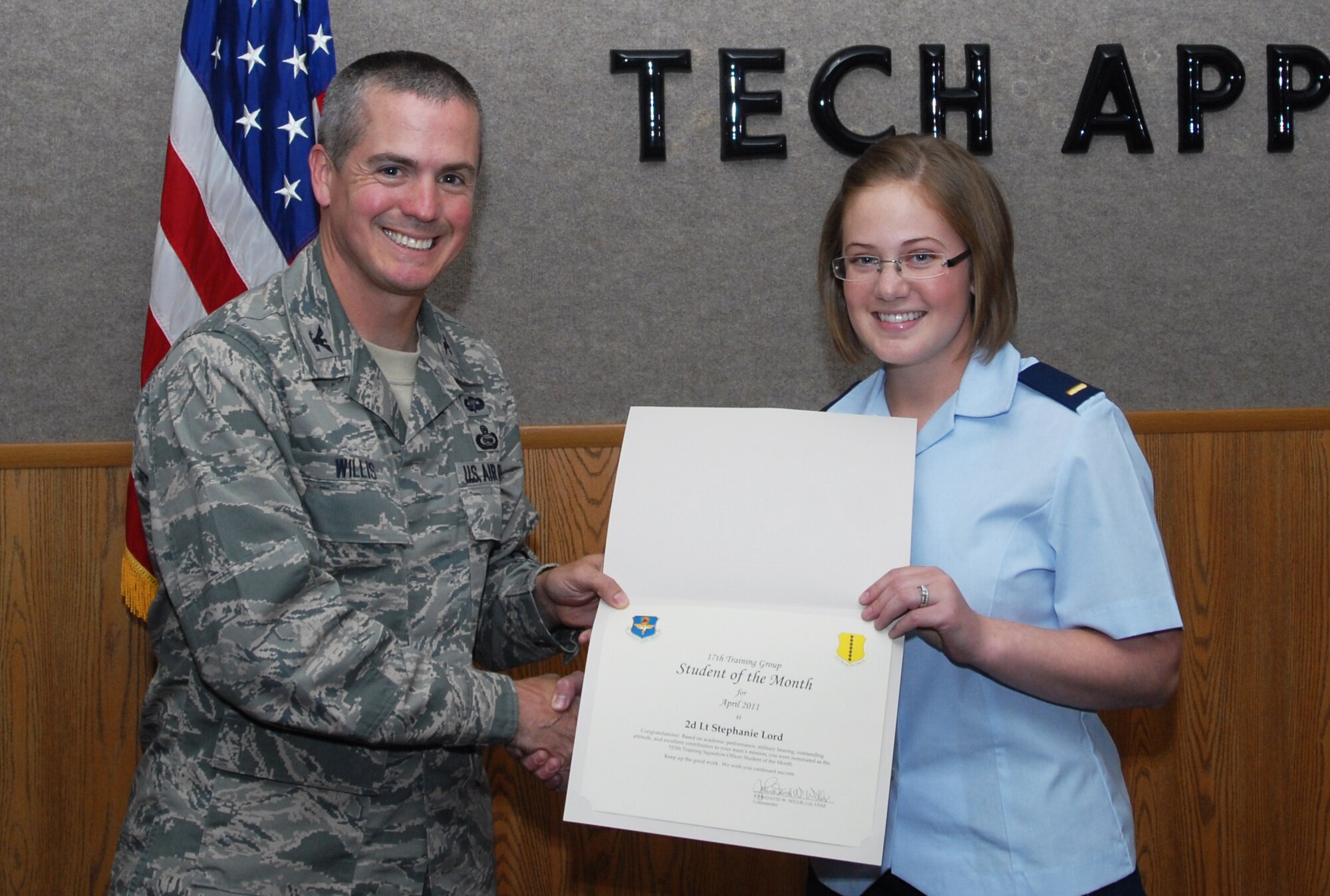 GOODFELLOW AIR FORCE BASE, Texas -- 2nd Lt. Stephanie Lord, 315th Training Squadron, receives Student of the Month certificate from Col. J.D. Willis, 17th Training Group commander, May 6, 2011. (U.S. Air Force photo/Airman 1st Class Michael Smith)