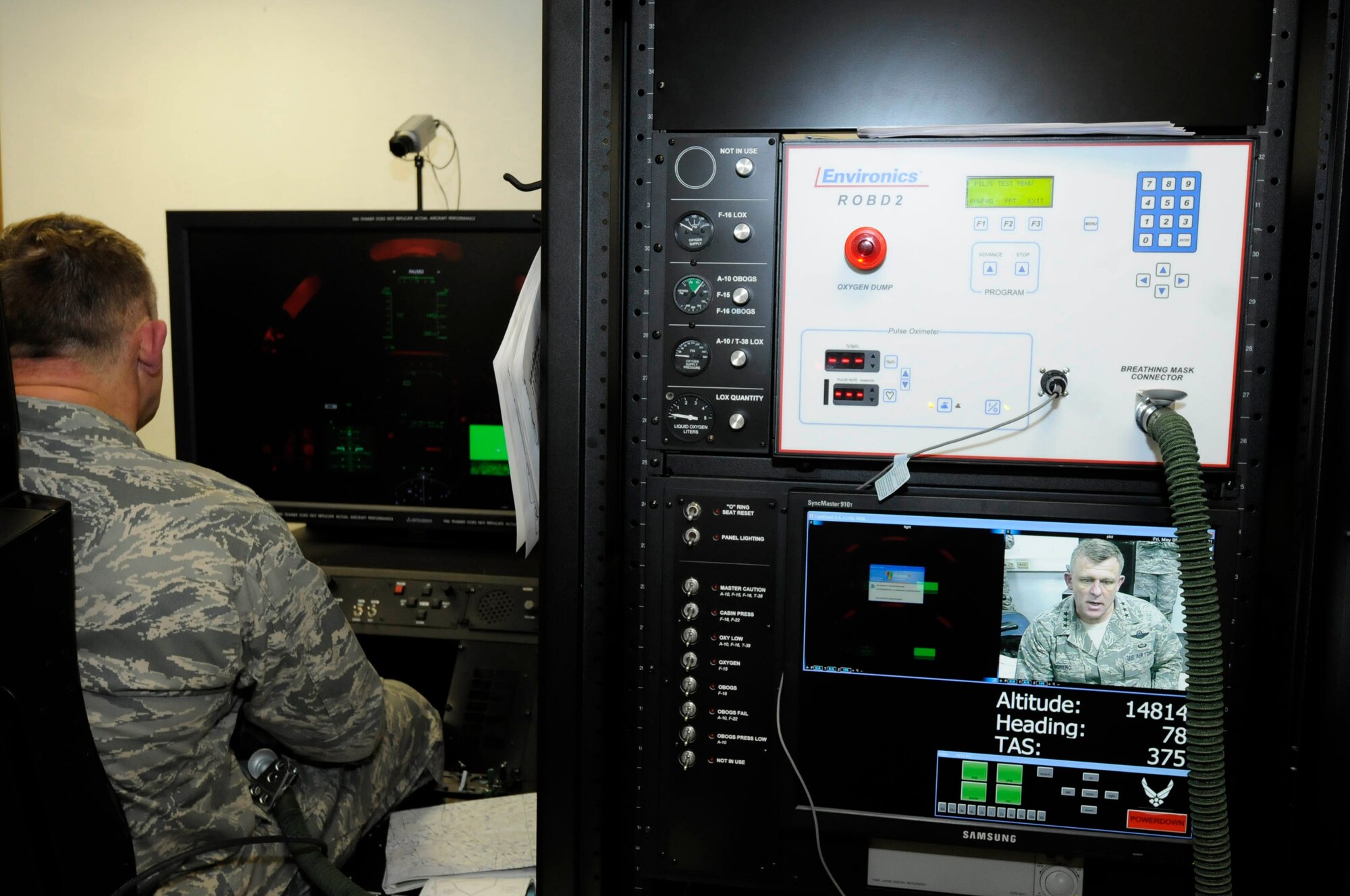 U.S. Air Force Lt. Gen. Frank Gorenc, 3rd Air Force commander, experiences how a reduced oxygen breathing device and a hypoxia familiarization trainer are both being used for refresher training for pilots, Ramstein Air Base, Germany, May 6, 2011. The ROBD/HFT are two new pieces of equipment the 86th Operation Support Squadron recently acquired for helping train aircrews to recognize and properly respond to the effects of hypoxia. (U.S. Air Force photo by Airman Kendra Alba)