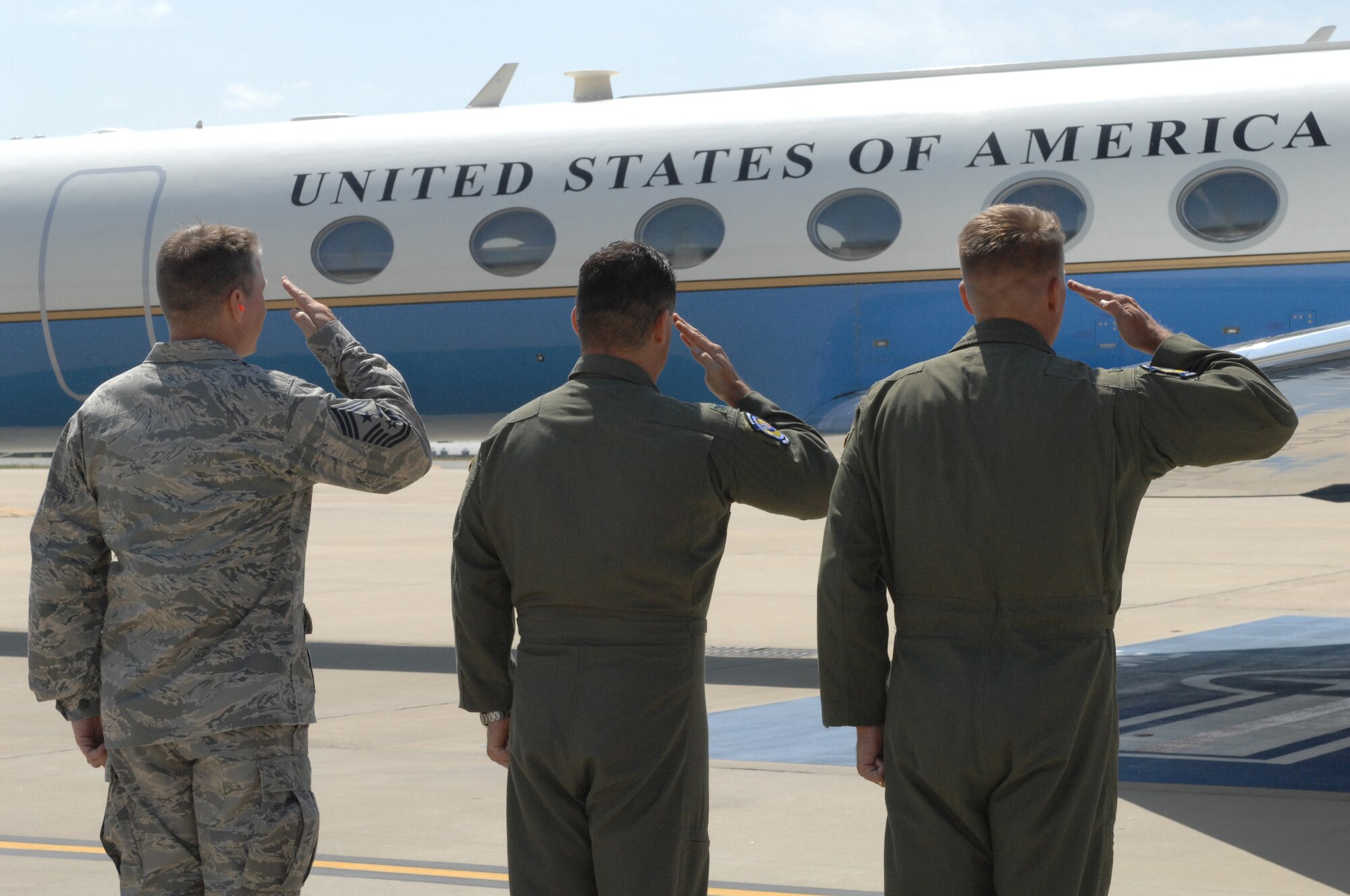 SEYMOUR JOHNSON AIR FORCE BASE, N.C.-- Command Chief Master Sgt. Blake Malpass, 4th Fighter Wing vice commander Col. Shawn Pederson , and commander Col. Patrick Doherty each render a salute as Secretary of Defense Robert M. Gates departs after speaking with Team Seymour here May 6, 2011.  (U.S. Air Force photo/2nd Lt Keavy Rake)(RELEASED)