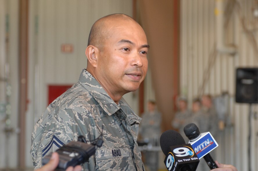 SEYMOUR JOHNSON AIR FORCE BASE, N.C. -- Senior Master Sgt. Arnel Abad, 4th Civil Engineer Squadron operations superintendent, speaks with news reporters regarding his presentation of a Bronze Star Medal by Secretary of Defense Robert M. Gates here, May 6, 2011. (U.S. Air Force photo/2nd Lt Keavy Rake) (RELEASED)