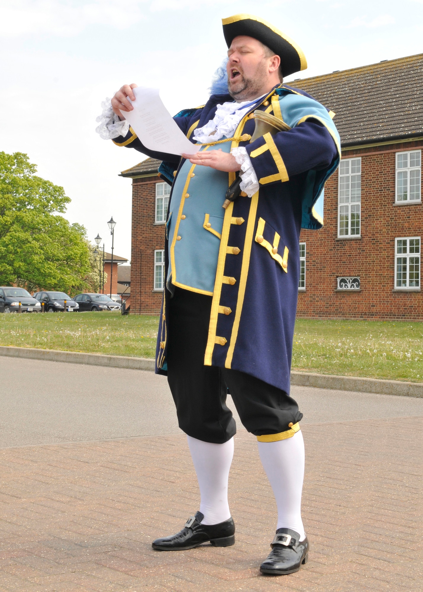 ROYAL AIR FORCE LAKENHEATH, England - Mike Blackburn, St. Neots Town Crier, reads a proclamation during a visit to Lakenheath Middle School for U.K. Day on May 6, 2011. U.K. Day provided a multitude of events and activities for the LMS students to learn about the history and culture of England. Nearly 60 British performers educated the children on activities ranging from traditional English dances to playing cricket. (U.S. Air Force photo/Senior Airman Tiffany M. Deuel)