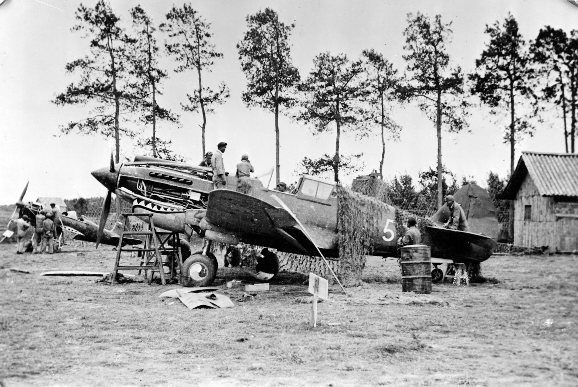 Repairing a Flying Tiger P-40 at Kunming, China. (U.S. Air Force photo)