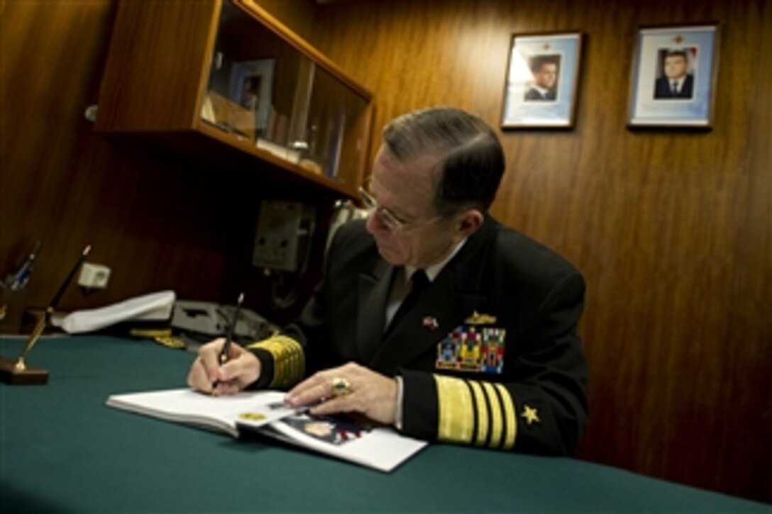 Chairman of the Joint Chiefs of Staff Adm. Mike Mullen, U.S. Navy, signs a guestbook onboard the Russian corvette Steregushchiy in Petersburg, Russia, on May 7, 2011.  Mullen is on a three-day trip to the country to meet with Chief of the General Staff of the Armed Forces of Russia Gen. Nikolai Makarov.  