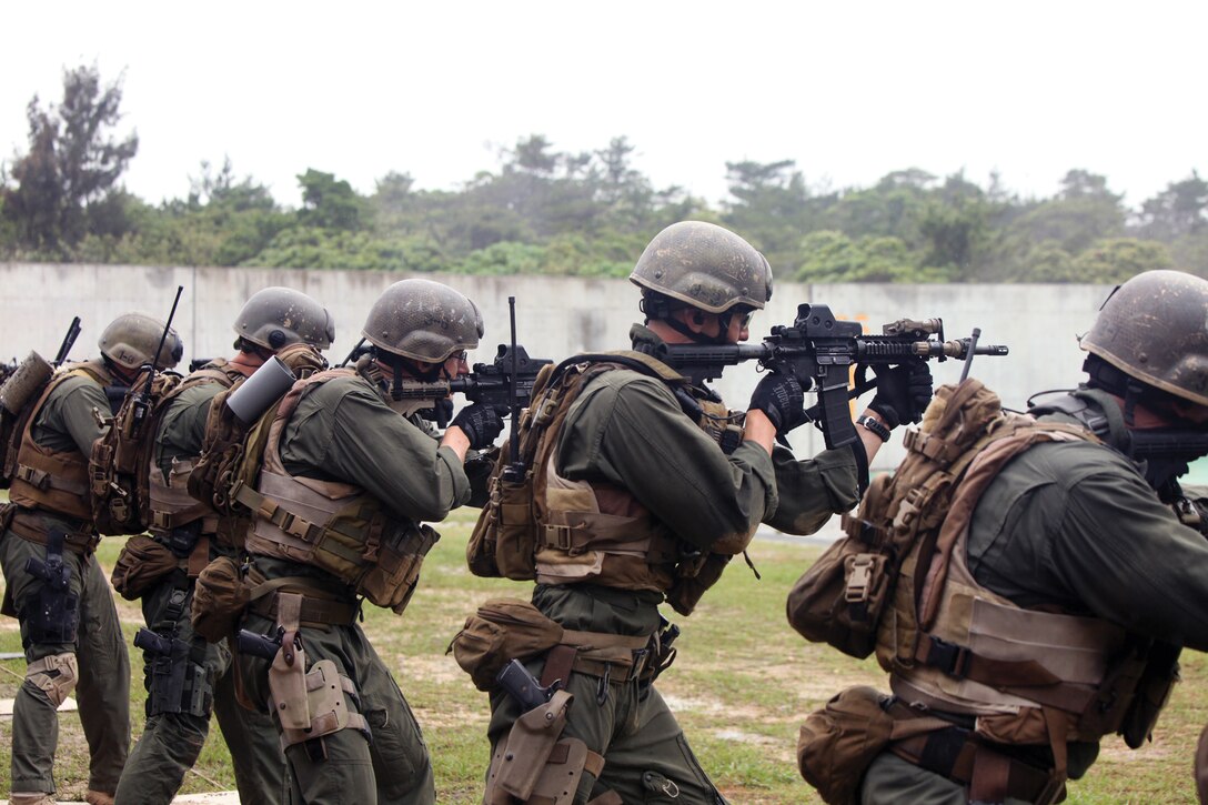 Marines fire their M4A1 carbines during marksmanship training May 10 as a part of the Dynamic Assault Course at Camp Hansen’s Range 16. The Marines are from Force Reconnaissance Platoon, Force Company, 31st Marine Expeditionary Unit, III Marine Expeditionary Force, and need the certification provided by the course to operate as a force reconnaissance platoon.