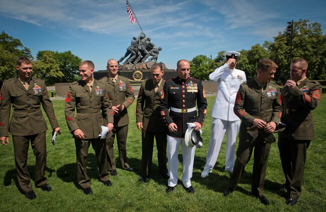 Marines with 1st Reconnaissance Battalion joined Gunnery Sgt. Brian M. Blonder at the Marine Corps War Memorial in Arlington, Va., May 10, 2011, when he was awarded the Navy Cross. Blonder, a reconnaissance Marine, received the second highest award given for valor in the face of danger for his actions during an all-day firefight against Taliban insurgents Aug. 8, 2008, during the battle of Shewan, Afghanistan. Although he and the Marines and sailors he was fighting alongside with were heavily outnumbered against insurgents, they managed to kill more than 50 insurgents and drove the rest out of their fortified fighting positions in the Taliban infested village in southern Farah province. Blonder was serving as platoon sergeant with a force reconnaissance platoon attached to 2nd Battalion, 7th Marine Regiment. From left to right, Sgt. David Nisbeth, Sgt. Erik Loyd, Gunnery Sgt. Thomas Hartrick, Gunnery Sgt. John Rosenberg, Gunnery Sgt. Brain Blonder, Chief Petty Officer Joe Martin, Gunnery Sgt. Garrett Dean and Gunnery Sgt. Craig Wheeler all fought in the battle of Shewan.