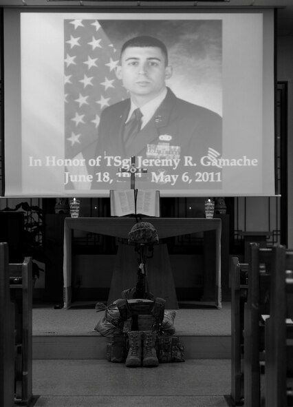KUNSAN AIR BASE, Republic of Korea -- Wolf Pack members come together in a moment of silence at a memorial ceremony for fallen former 8th Security Forces Squadron member, Tech. Sgt. Jeremy Gamache, at the base chapel here May 10. (U.S. Air Force photo/Senior Airman Ciara Wymbs)