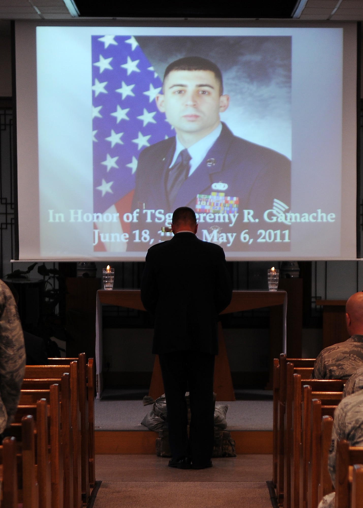 KUNSAN AIR BASE, Republic of Korea -- Wolf Pack members come together in a moment of silence at a memorial ceremony for fallen former 8th Security Forces Squadron member, Tech. Sgt. Jeremy Gamache, at the base chapel here May 10. (U.S. Air Force photo/Senior Airman Ciara Wymbs)