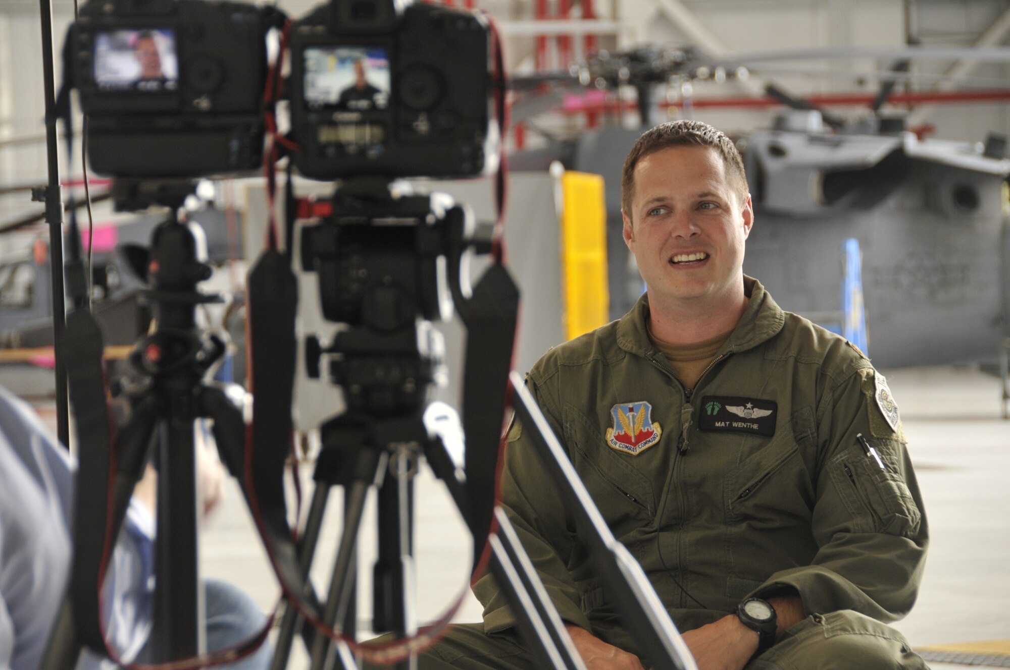 Maj. Mathew Wenthe, an HH-60G Pave Hawk helicopter pilot with the 129th Rescue Squadron, is interviewed by David Scantling, a film director and producer for Waltzing Matilda Films, regarding an August 26, 2009 rescue mission in Afghanistan involving Marines from 1st Battalion, 5th Marines. The interview is for a documentary called "Patrol Base Jaker."  (Air National Guard photo by Tech. Sgt. Ray Aquino)