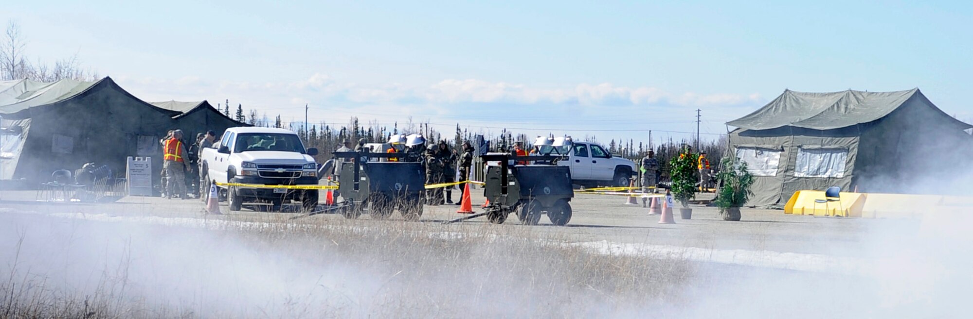 Airmen participate in a base-wide operational readiness exercise evaluation May 5, 2011, Eielson Air Force Base, Alaska. The evaluation tests Airmen's ability to survive and operate in a simulated chemical, biological, radiological, nuclear, and high yield explosive environment.  (U.S. Air Force photo/Airman 1st Class Laura Goodgame) 