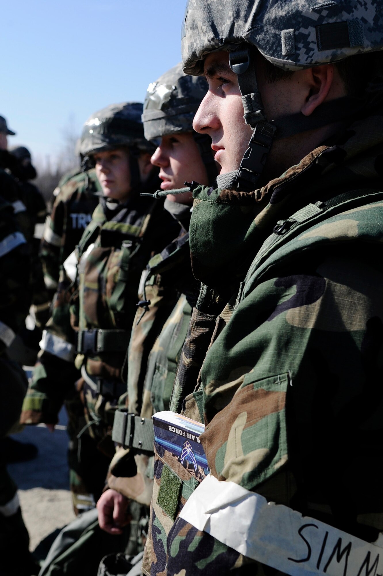 Airman 1st Class Justin Baker (Right) and fellow Airmen listen closely to instructions given from evaluators during an operational readiness exercise evaluation May 5, 2011, Eielson Air Force Base, Alaska. The evaluation tests Airmen's ability to survive and operate in a simulated chemical, biological, radiological, nuclear, and high yield explosive environment.  Airman Baker is assigned to the 354th Contracting Squadron. (U.S. Air Force photo/Airman 1st Class Laura Goodgame) 
