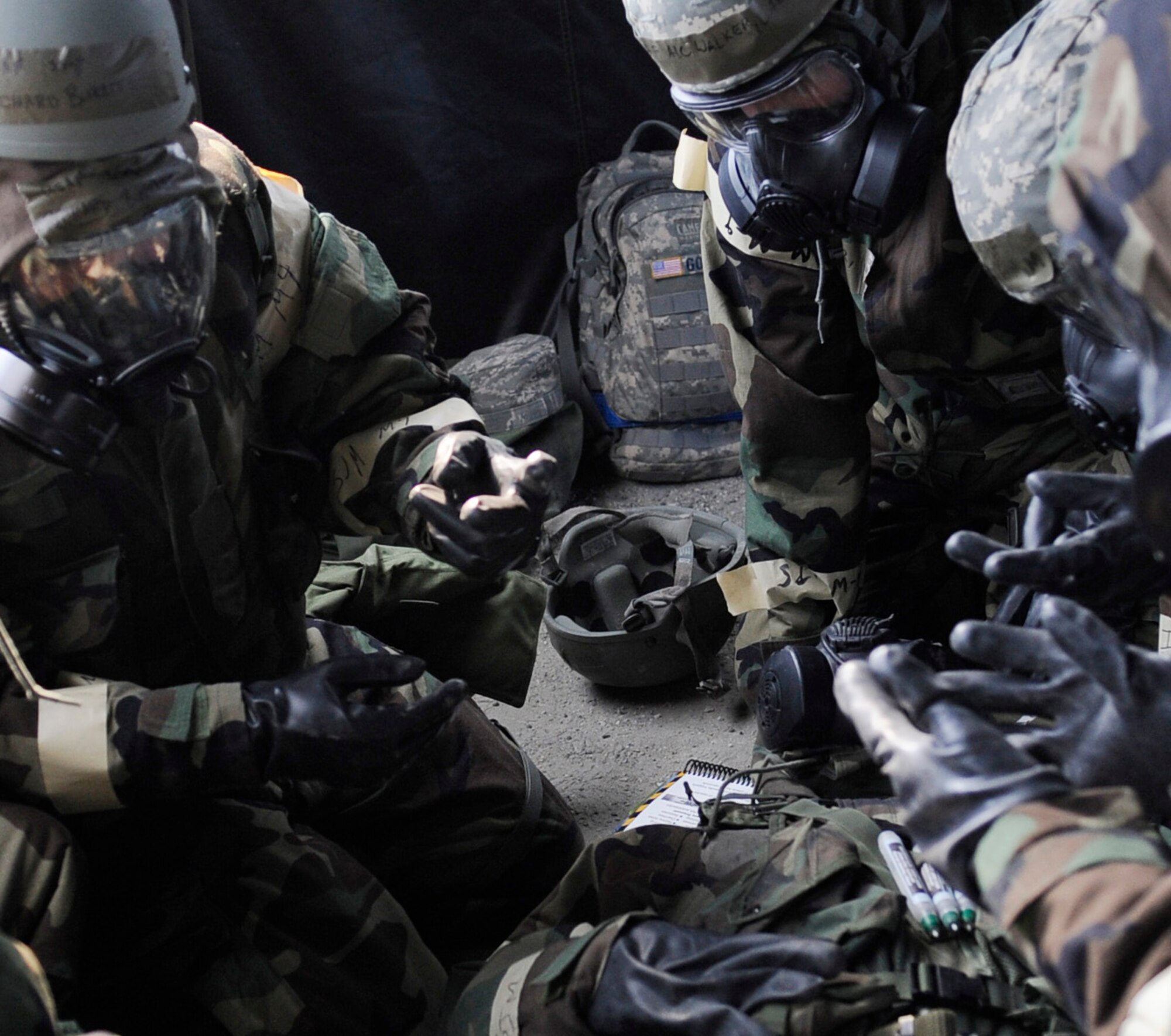 Airmen evaluate a patient after simulating treatment for a nerve agent during an operational readiness exercise evaluation May 5, 2011, Eielson Air Force Base, Alaska. The evaluation tests Airmen's ability to survive and operate in a simulated chemical, biological, radiological, nuclear, and high yield explosive environment.  (U.S. Air Force photo/Airman 1st Class Laura Goodgame) 