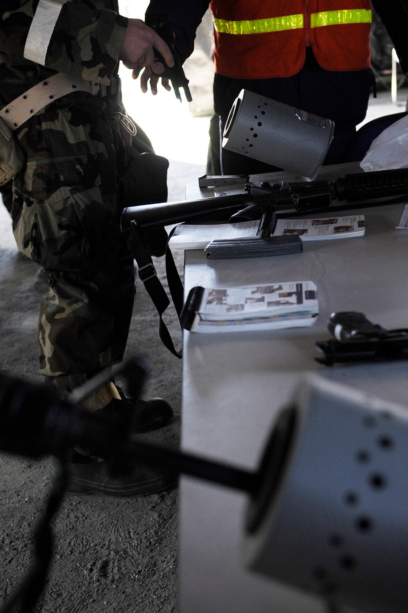 Airmen go through a weapons clearing evaluation during an operational readiness exercise May 5, 2011, Eielson Air Force Base, Alaska. The evaluation tests Airmen's ability to survive and operate in a simulated chemical, biological, radiological, nuclear, and high yield explosive environment.  (U.S. Air Force photo/Airman 1st Class Laura Goodgame) 