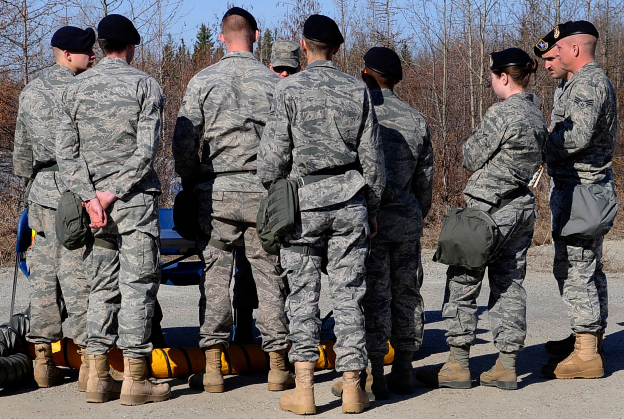 354th Security Forces Squadron Airmen prepare to in-process during an operational readiness exercise evaluation May 5, 2011, Eielson Air Force Base, Alaska. The evaluation tests Airmen's ability to survive and operate in a simulated chemical, biological, radiological, nuclear, and high yield explosive environment. One hundred Airmen can be processed through the ORE in two hours. (U.S. Air Force photo/Airman 1st Class Laura Goodgame) 