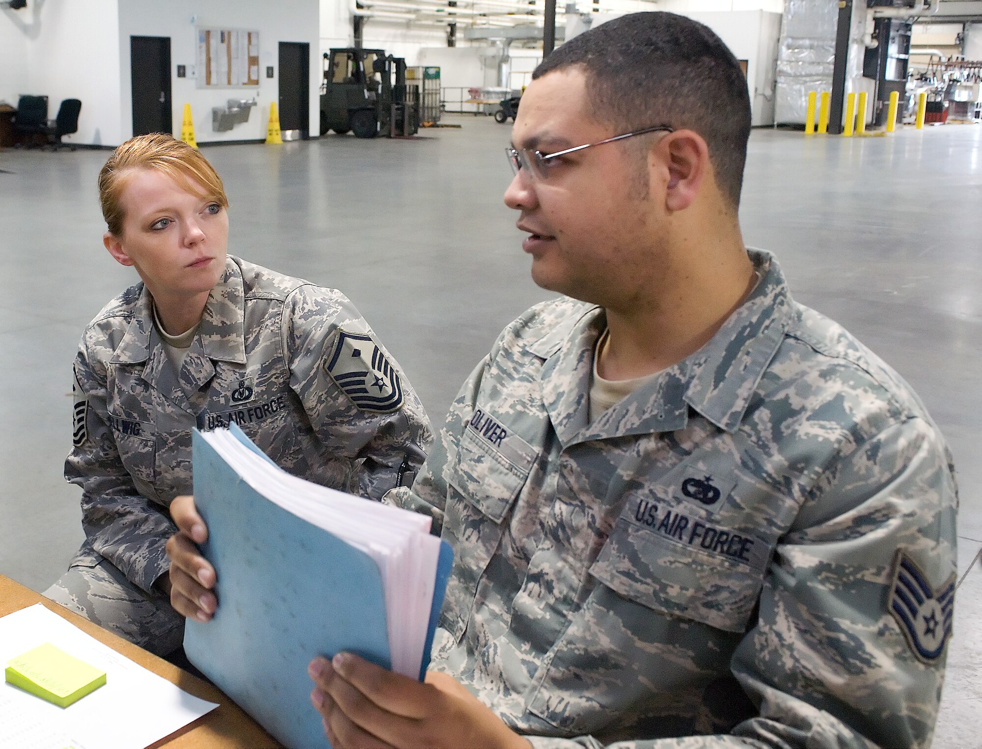 Master Sgt. Jennifer Hellwig meets with Staff Sgt. Jonathan Oliver, while she makes her morning rounds May 10, 2011, at Dover Air Force Base, Del. Sergeant Hellwig is responsible for ensuring the moral, health and welfare of more than 500 servicemembers.
(U.S. Air Force photo by Steve Kotecki)
