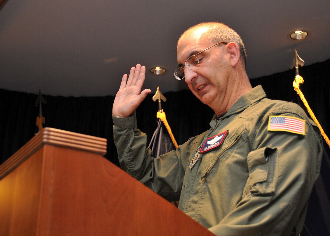 Brian Matthew is given the oath of enlistment by Brig. Gen. James J. Muscatell Jr., May 6, 2011, Niagara Falls Air Reserve Station, N.Y.   Brig. Gen. Muscatell is the commander, 403rd Wing, Keesler Air Force Base, Miss., was touring the Buffalo MEPS facility located on the Niagara base along with a group of civic leaders from the Biloxi Miss. area.  (U.S. Air Force photo by Staff Sgt. Joseph McKee)