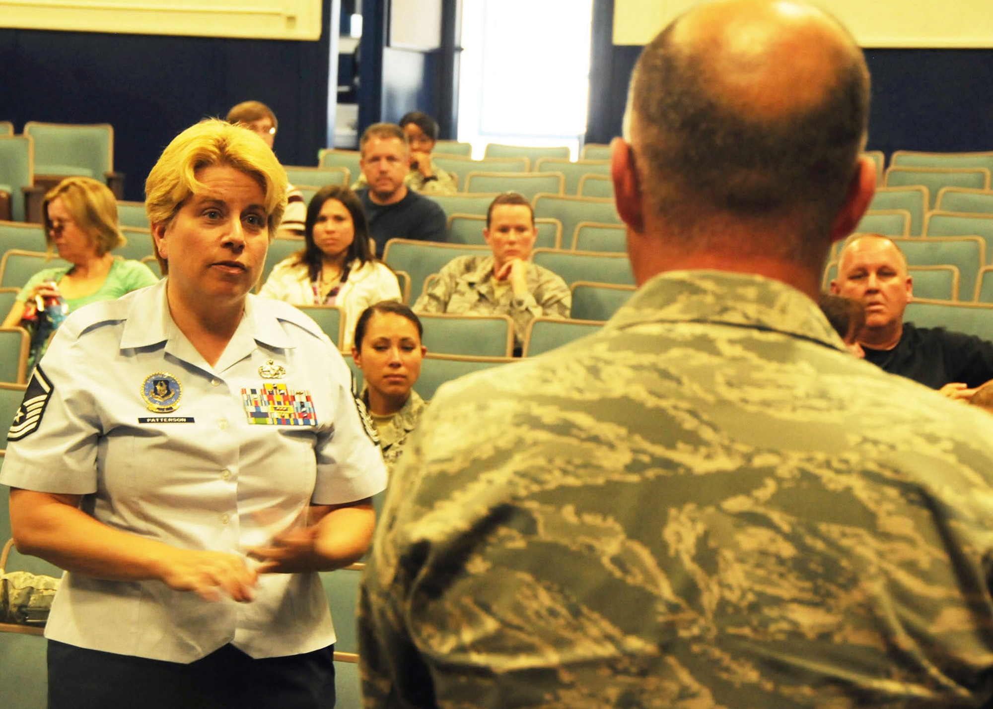 Master Sgt. Vicki Patterson, a local Reserve recruiter from the Eastern Regional Recruiting Squadron, poses a question to Chief Master Sgt. Dwight Badgett, the command chief for Air Force Reserve Command, following his mass briefing at Duke Field May 6.  Chief Badgett, the command’s top advocate for more than 60,000 Reserve and active-duty AFRC enlisted members, visited the 919th Special Operations Wing  May 5-6 to thank its enlisted Airmen them for their service, respond to their feedback and brief them on force development and other career enhancement programs and topics.  (U.S. Air Force photo/Adam Duckworth)

