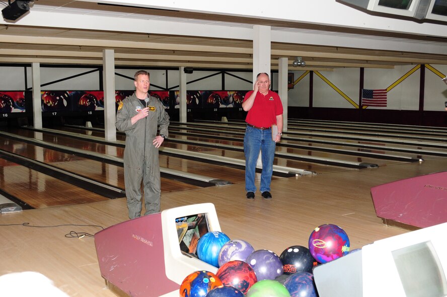 Wing Vice Commander Lt. Col. Jon Safstrom and Senior Master Sgt. William McRae of the 148th Fighter Wing, Duluth, Minn. announce the start of the Air National Guard Bowling Tournament held at Country Lanes in Duluth, Minn. on May 6, 2011.  Retired and current members of the ANG from across the country took part in the bowling tournament. (U.S. Air Force photo by Staff Sgt. Donald Acton/released)