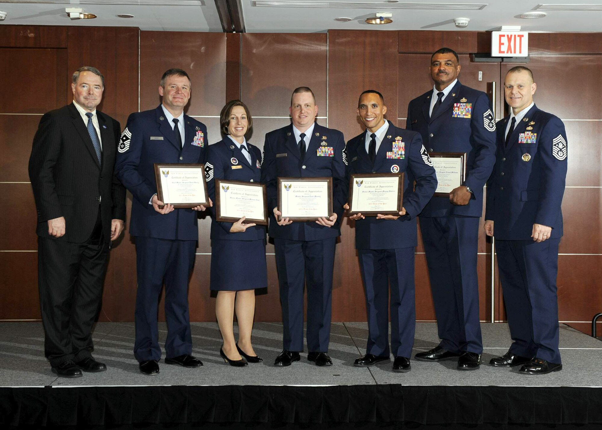 Air Force First Sergeants were honored as the 2011 Air Force Association Team of the Year during a ceremony in Rosslyn, Va. on May 2, 2011. AFA President Michael M. Dunn and Chief Master Sgt. of the Air Force James Roy pose with special duty representatives (from left) Chief Master Sgt. David R. Henry, Senior Master Sgt. Melanie K. Noel, Master Sgt. Todd K. Meaney, Senior Master Sgt. Manny Pi?eiro and Senior Master Sgt. Ernest T. Williams. (U.S. Air Force photo/Andy Morataya)