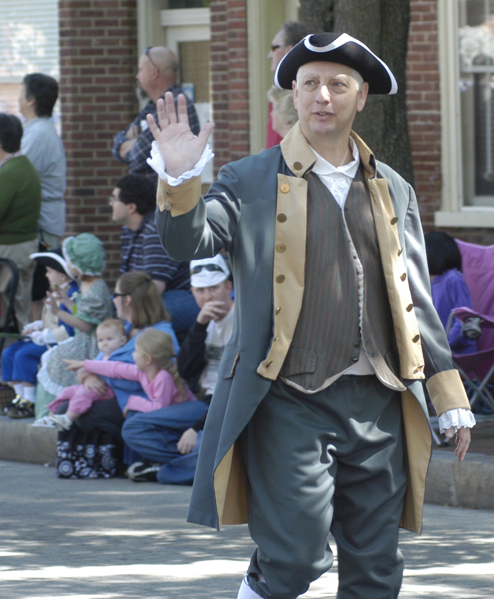Col. Mark Camerer, 436th Airlift Wing commander, dressed in 18th century clothing, marches during the Dover Days Parade May 7, 2011, at Dover, Del. Colonel Camerer marched with other Airmen from the 436 AW to show his support for the city of Dover. (U.S. Air Force photo by Airman 1st Class Matthew Hubby)