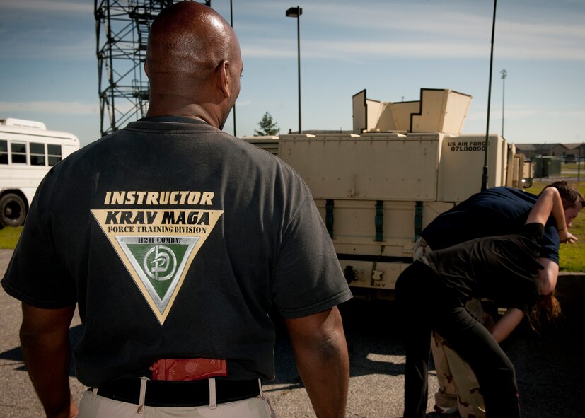 MOODY AIR FORCE BASE, Ga.-- A Krav Maga instructor observes an Airman attempting to break a choke hold during a training scenario April 5. Krav Maga is the official self-defense system of the Israeli defense forces. Base defense and security forces squadrons have applied the techniques to better prepare Airmen for combat defense.  (U.S. Air Force photo/Airman 1st Class Joshua Green)(RELEASED)
