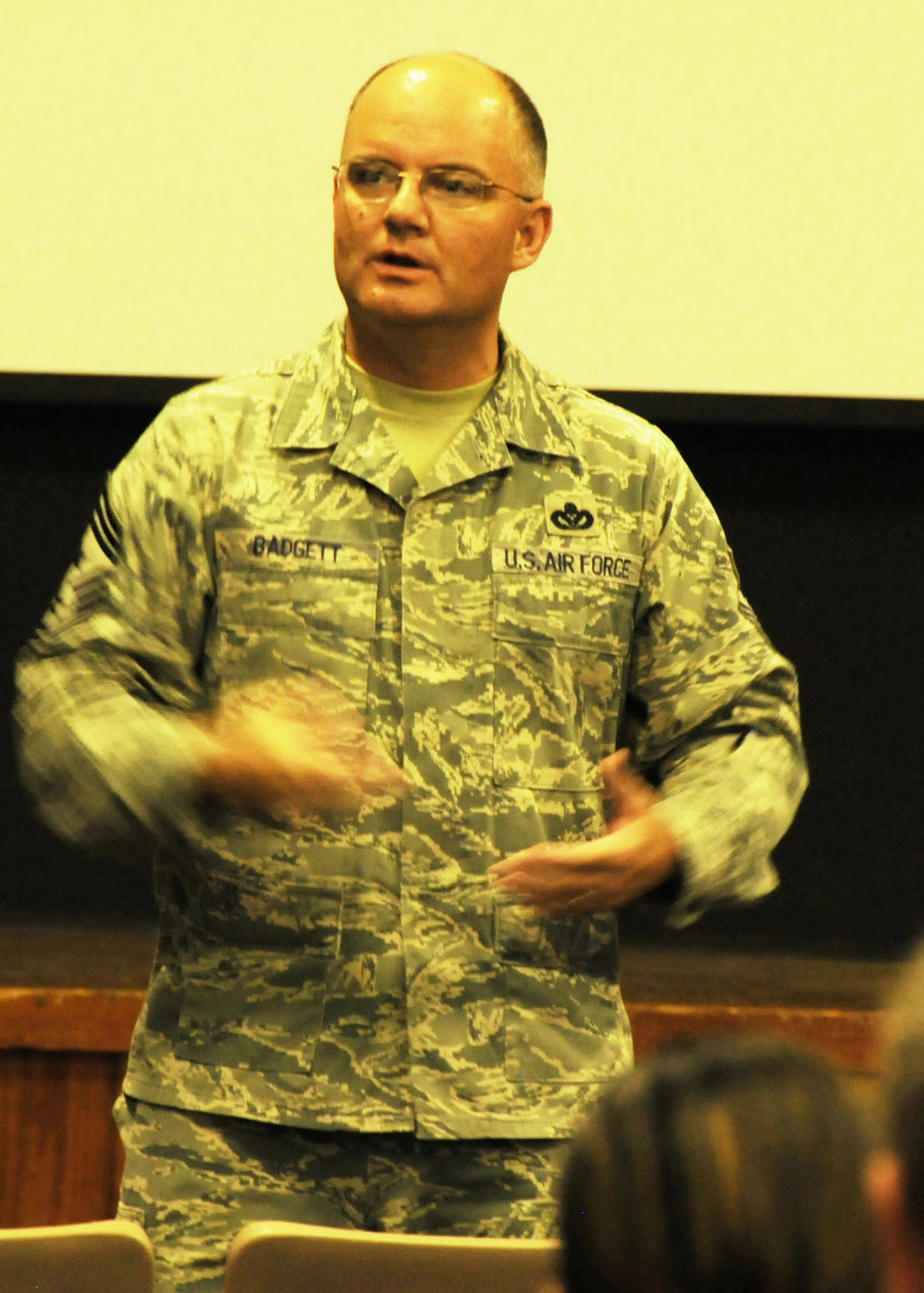 Chief Master Sgt. Dwight Badgett, the command chief for Air Force Reserve Command, delivers remarks during a mass briefing for Duke Field enlisted reservists at Spectre Hall May 6.  Chief Badgett, the command’s top advocate for more than 60,000 Reserve and active-duty AFRC enlisted members, visited the 919th Special Operations Wing May 5-6 to thank its enlisted Airmen for their service, respond to their feedback and brief them on force development and other career enhancement programs and topics.  (U.S. Air Force photo/Adam Duckworth)