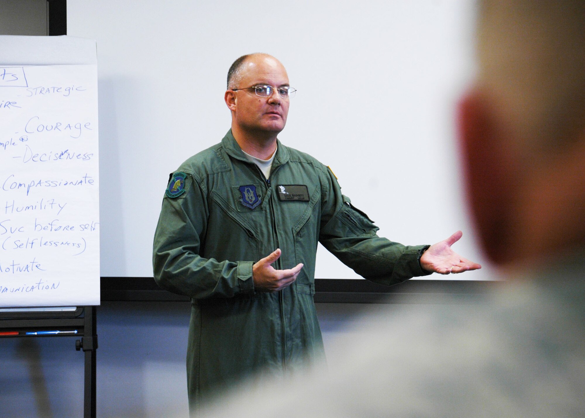 Chief Master Sgt. Dwight Badgett, the command chief for Air Force Reserve Command, speaks to reservist Airmen at Duke Field’s NCO Leadership Development Course May 6.  Chief Badgett, the command’s top advocate for more than 60,000 Reserve and active-duty AFRC enlisted members, visited the 919th Special Operations Wing  May 5-6 to thank its enlisted Airmen them for their service, respond to their feedback and brief them on force development and other career enhancement programs and topics.  (U.S. Air Force photo/Dan Neely)