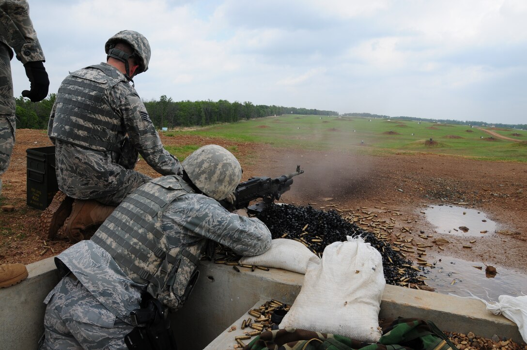 U.S. Air Force Combat Arms Instructor assigned to the 137th Security Forces Squadron, fires down range using the M240B during a day of qualification on Camp Gruber, April 22, 2011. 
(U.S. Air Force photo by Staff Sgt Caroline Hayworth/Released)