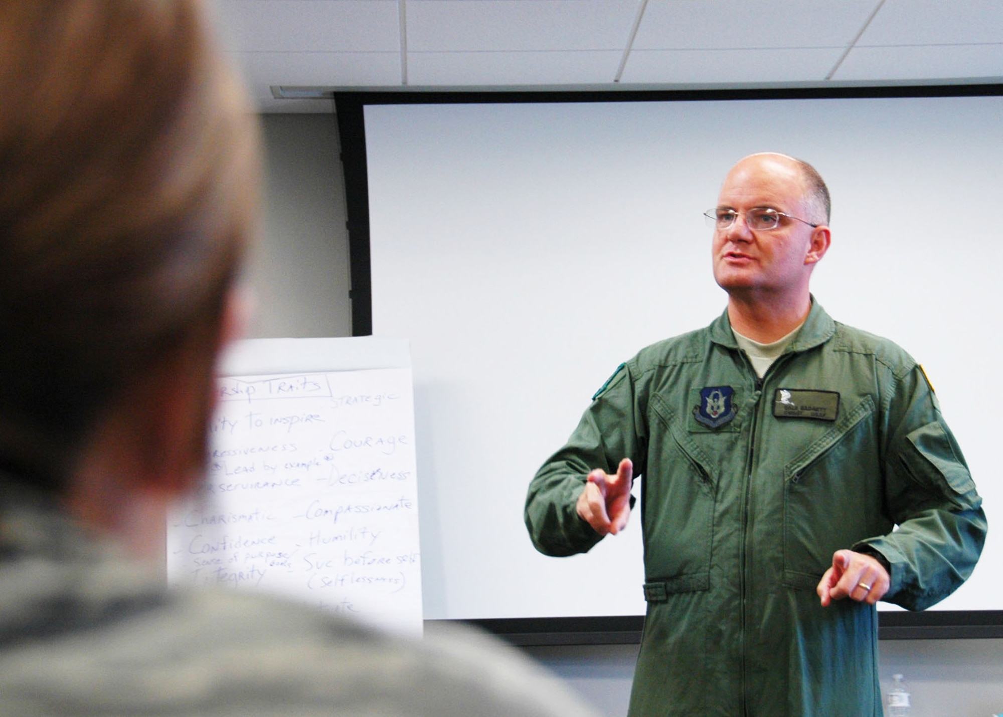 Chief Master Sgt. Dwight Badgett, the command chief for Air Force Reserve Command, speaks to reservist Airmen at Duke Field’s NCO Leadership Development Course May 6.  Chief Badgett, the command’s top advocate for more than 60,000 Reserve and active-duty AFRC enlisted members, visited the 919th Special Operations Wing  May 5-6 to thank its enlisted Airmen for their service, respond to their feedback and brief them on force development and other career enhancement programs and topics.  (U.S. Air Force photo/Dan Neely)
