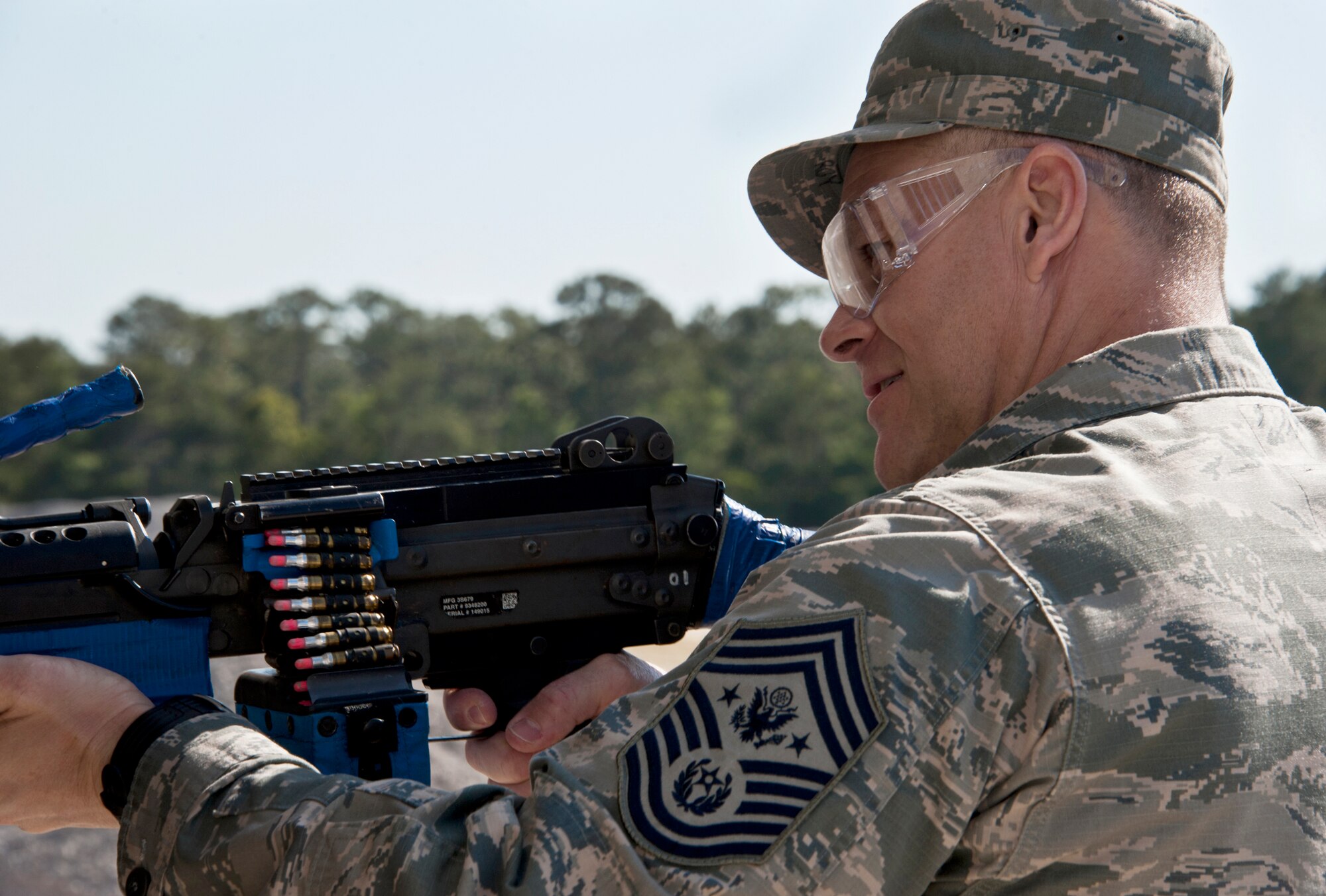 Chief Master Sgt. of the Air Force James A. Roy takes aim at a target inside a building with a simulated munition-loaded M-249 during his tour of the 96th Ground Combat Training Squadron's training area May 6, 2011, at Eglin Air Force Base, Fla. The chief received a hands-on "Brave Defender" experience with the 96th GCTS, firing weapons, watching demonstrations and driving a humvee through a village with simulated improvised explosive devices. (U.S. Air Force photo/Samuel King Jr.)

