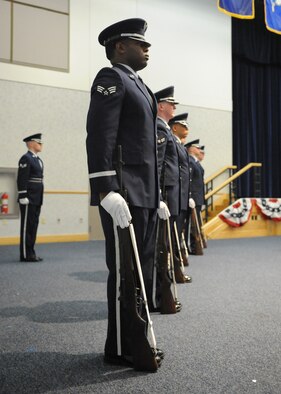 McConnell Honor Guard members stand at ease during a 20-man mock active duty funeral as part of their graduation ceremony from the base honor guard training program May 4, 2011, McConnell Air Force Base, Kan. The base honor guard training program performs in ceremonies that are standard Air Force-wide. Following eight days of specialized training, McConnell Honor Guard members staged a 20-man mock active duty funeral during a graduation ceremony May 4, 2011.  (U.S. Air Force Photo/Airman 1st Class Katrina M. Brisbin)