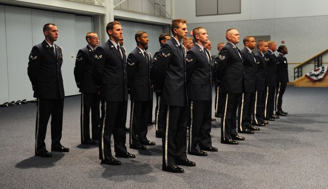 McConnell Honor Guard members prepare to graduate from the base honor guard training program May 4, 2011, McConnell Air Force Base, Kan. U.S. Air Force Honor Guard instructors from Joint Base Anacostia-Bolling, Washington, D.C., spent 65 hours training the honor guard members on military funeral honors. While at McConnell, USAF Honor Guard instructors answered questions about the honor guard manual, which is updated annually. (U.S. Air Force Photo/Airman 1st Class Katrina M. Brisbin)