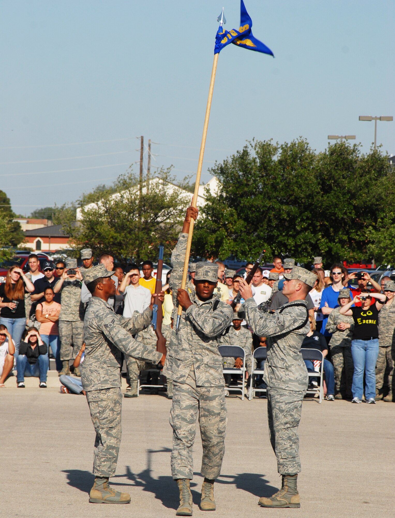 GOODFELLOW AIR FORCE BASE, Texas -- Airman 1st Class Raymone Jackson, 315th Training Squadron, hoists his squadrons guidon into the air at the drill competition, May 7, 2011. The 316 TRS won the exhibition portion of the drill competition.(U.S. Air Force photo/Airman 1st Class Michael Smith)
