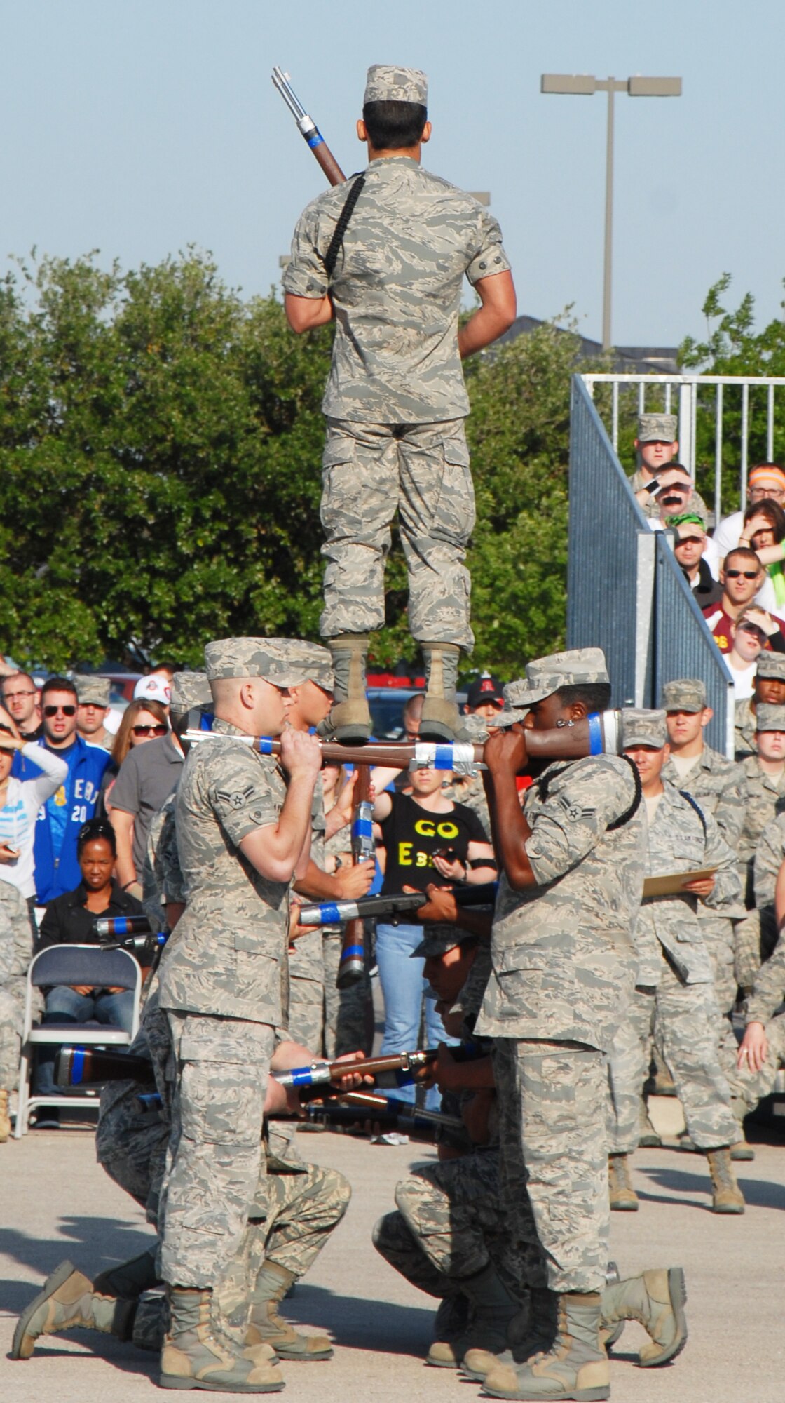 GOODFELLOW AIR FORCE BASE, Texas -- The 316th Training Squadron drill team elevate their team member into the air at the drill competition, May 7, 2011. The 316 TRS won the exhibition portion of the drill competition.(U.S. Air Force photo/Airman 1st Class Michael Smith)
