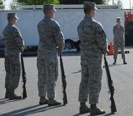 Tech. Sgt. Jean Todd, U.S. Air Force Honor Guard Drill Team member, observes as McConnell Honor Guard members perform firing party movements as part of the base honor guard training program April 29, 2011, McConnell Air Force Base, Kan. USAF Honor Guard instructors from Joint Base Anacostia-Bolling, Washington, D.C., spent 65 hours training the honor guard members on military funeral honors. Following eight days of specialized training, honor guard members staged a 20-man mock active duty funeral during a graduation ceremony May 4, 2011.  (U.S. Air Force Photo/Airman 1st Class Katrina M. Brisbin)